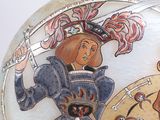 a decorative vase with a picture of a woman on it