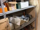 many boxes and boxes on the shelves in the room