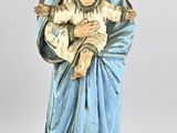 a statue of a woman holding a baby in her arms