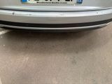 a silver car parked on the side of the road
