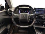the interior of a car with a steering wheel and dashboard controls
