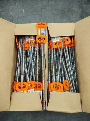 two boxes filled with screws and nails sitting on top of a floor
