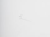 a picture of a clock on a wall with writing on it