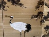 a painting of a crane standing in front of a pine tree
