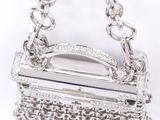 an image of a silver purse with a chain hanging from it