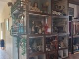 a room with a lot of stuff on the shelves