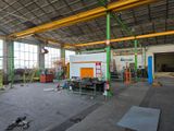 a large room with a lot of construction equipment in it