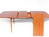 an image of a wooden table with two leaves on top of it