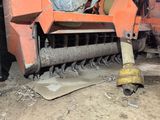 a machine that is sitting on the ground in the dirt