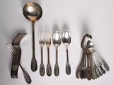 a lot of silver spoons and forks on the table