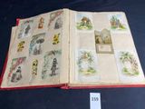 an open book with pictures of people and animals on it