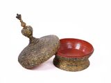 a small bowl and a small bowl on a white surface