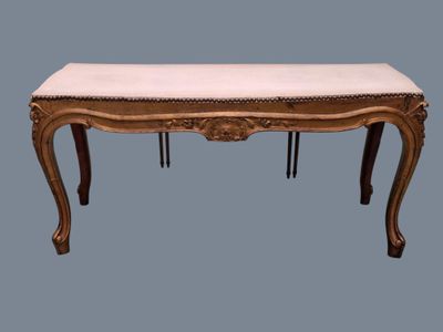 an image of a wooden bench with a white cushion on top