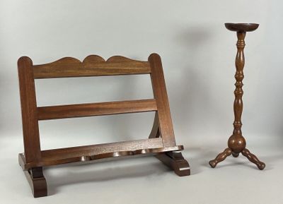 a wooden stand with a candle and a candle holder on it