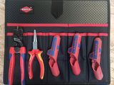 a close up of a tool roll with various tools in it
