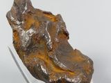 a piece of rock that has been placed on a glass stand