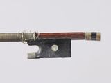 a bow that is attached to a piece of wood