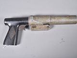 a gun that is sitting on a table