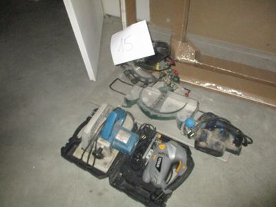 a bunch of tools sitting on the floor next to a door