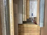 many books in a cardboard box on a shelf