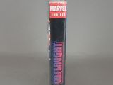 the back of a tube of marvel comics on a gray surface