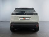 the rear end of a white suv parked in a white room