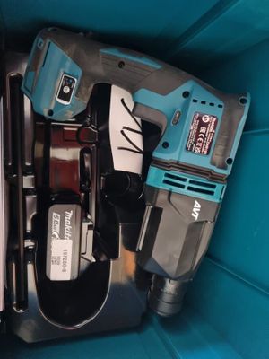 two electric tools in a blue box on a table