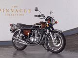 a motorcycle that is parked in front of a wall