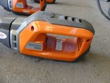 two chainsaws that are sitting on the ground