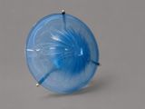 an image of a blue glass object on a gray surface