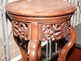 a wooden table with a carved design on it