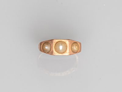 an image of a gold ring with pearls on it