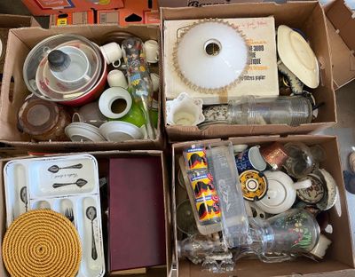 a box full of assorted items that are sitting on the floor