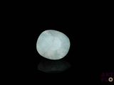 an image of a white stone on a black surface