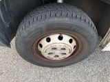 a close up of a flat tire on a truck