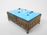 an image of a blue glass box sitting on top of a table