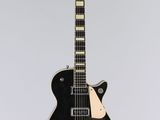 an electric guitar with a black body and a white neck