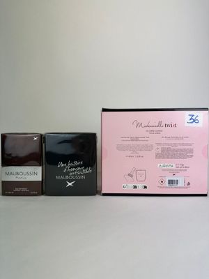 two boxes of coffee sit next to each other on a table