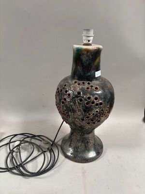 a lamp that is sitting on a table next to a lamp