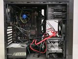 a black computer case with wires and wires attached to it