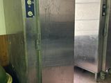 a picture of a commercial stainless steel refrigerator in a kitchen