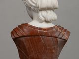 marble bust of a woman on a marble pedestal