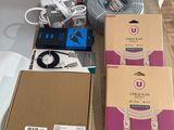 a box of electronics sitting on a table next to a box of wires