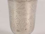 an image of a silver cup sitting on top of a table