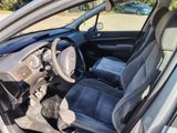 the interior of a car with a steering wheel and a dashboard