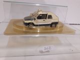 a small toy truck in a clear display case