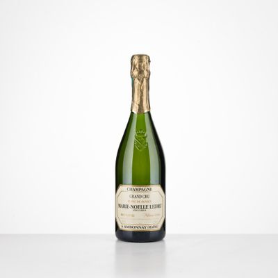 a bottle of champagne sitting on top of a table