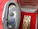 a box with a lighter inside of it on a red cloth