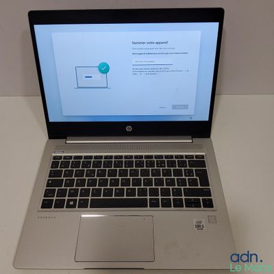 an open laptop computer sitting on top of a white table