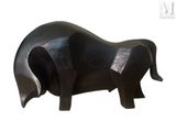 a black sculpture of a bull on a white background